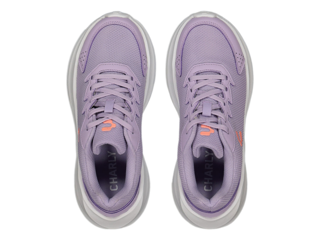 Tenis deportivos Charly color lila con suela blanca y tejido de malla.