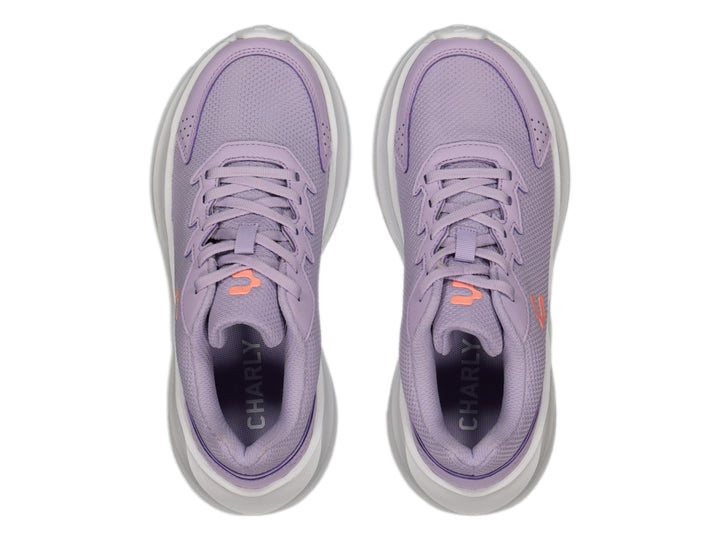 Tenis deportivos Charly color lila con suela blanca y tejido de malla.