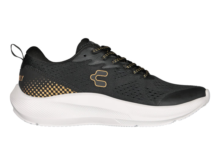 Tenis deportivos Charly color negro con detalles en oro y suela blanca gruesa.