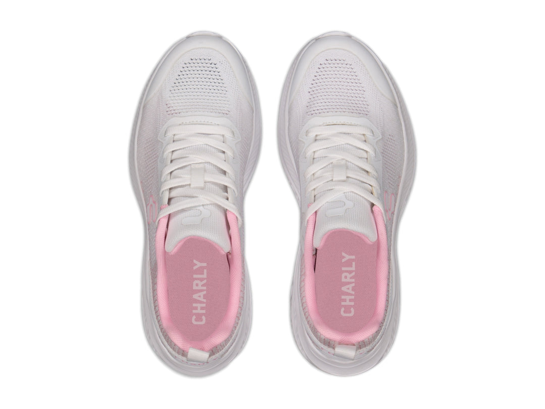 Tenis deportivos Charly en color blanco con detalles en rosa, diseño casual y suela blanca.