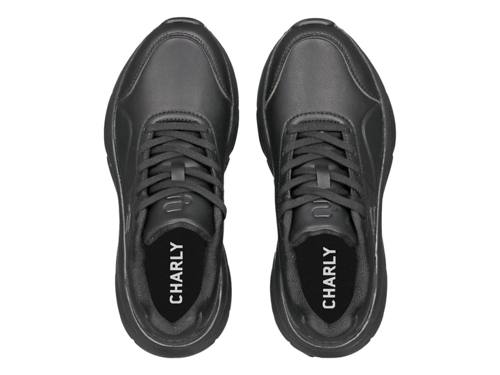 Tenis deportivos Charly color negro total con suela robusta y diseño moderno.
