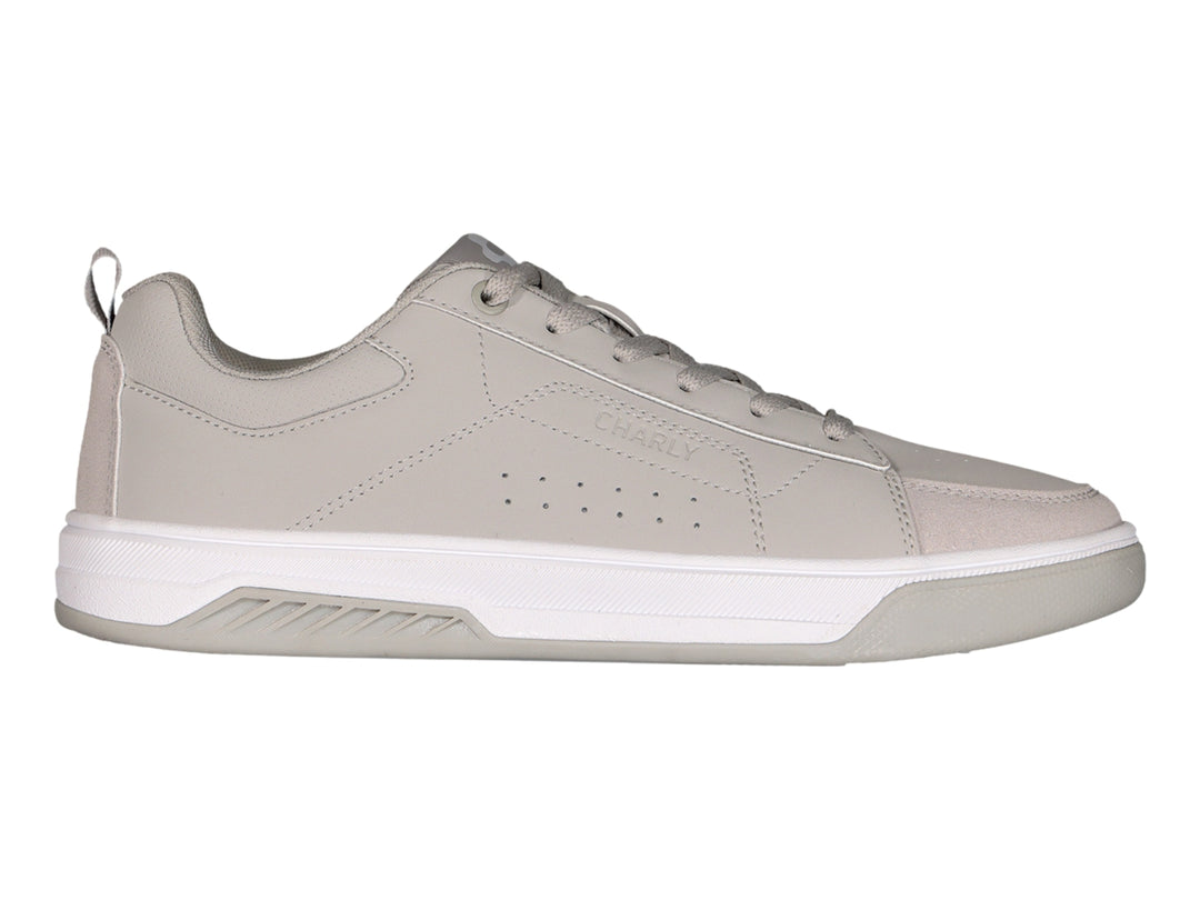 Tenis Charly color gris urbano con suela blanca y cordones, vista lateral.