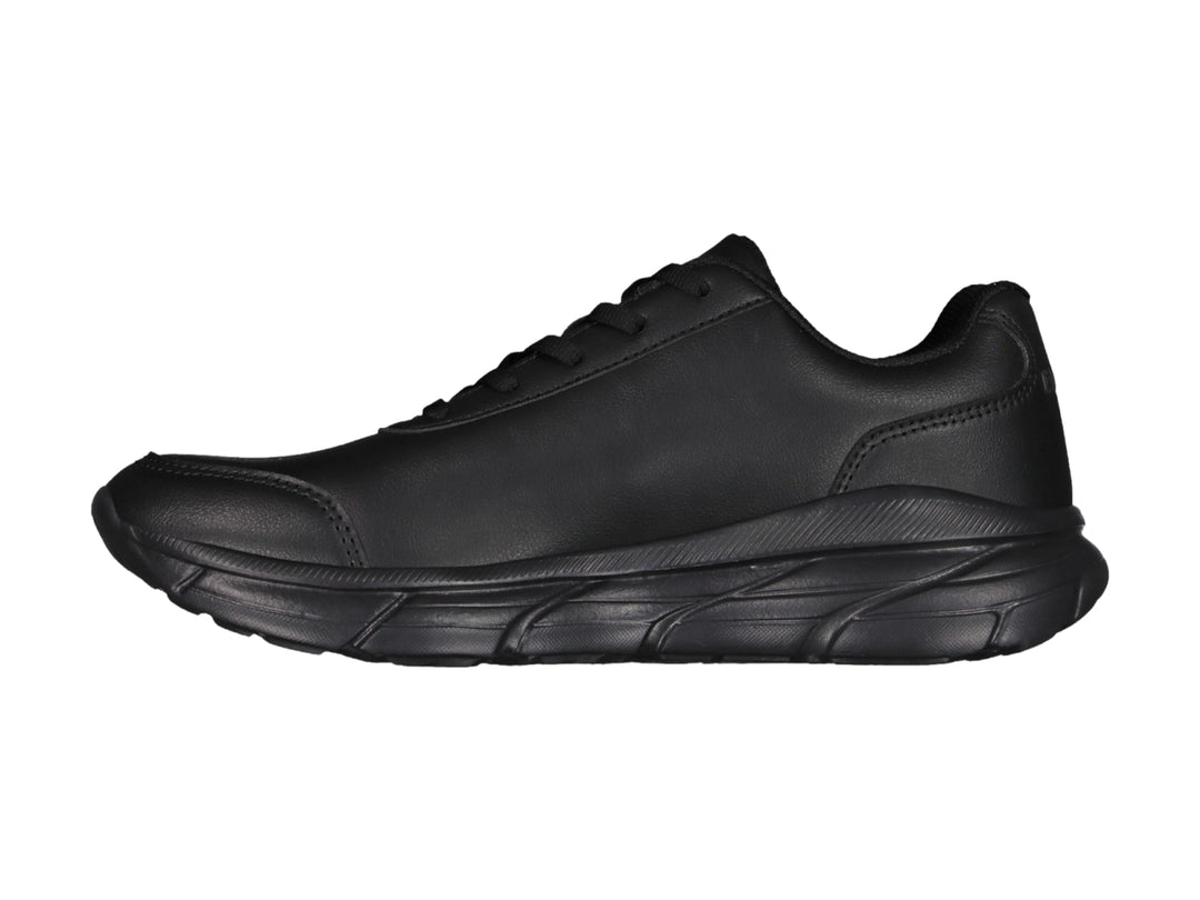 Tenis deportivos color negro de la marca Charly con suela gruesa y acabado mate.