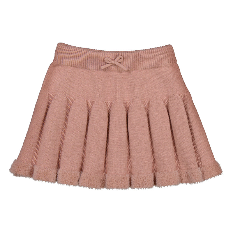 Falda plisada de color rosa maquillaje para niña con un pequeño moño en la cintura.