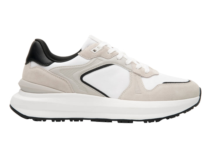 Tenis Flexi color blanco y gris con detalles negros y suela blanca ancha