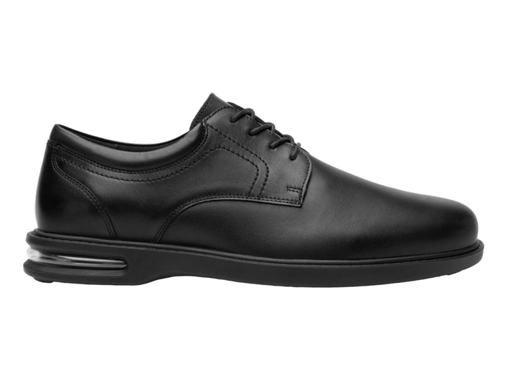 Zapato formal negro de cuero con cordones y amortiguación visible en la suela.