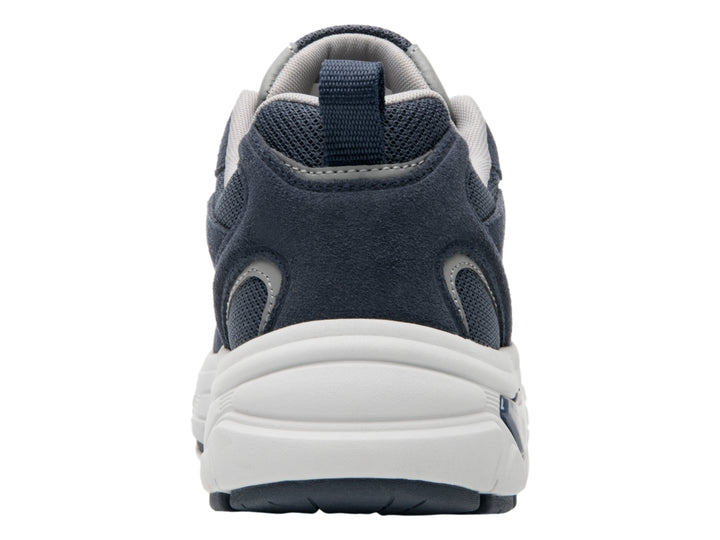 Tenis deportivos Flexi en color azul marino con suela blanca y detalles sintéticos.