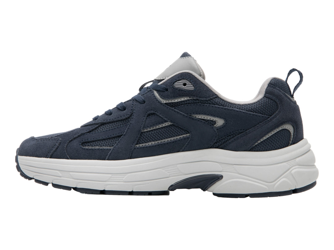 Tenis deportivos Flexi en color azul marino con suela blanca y detalles sintéticos.