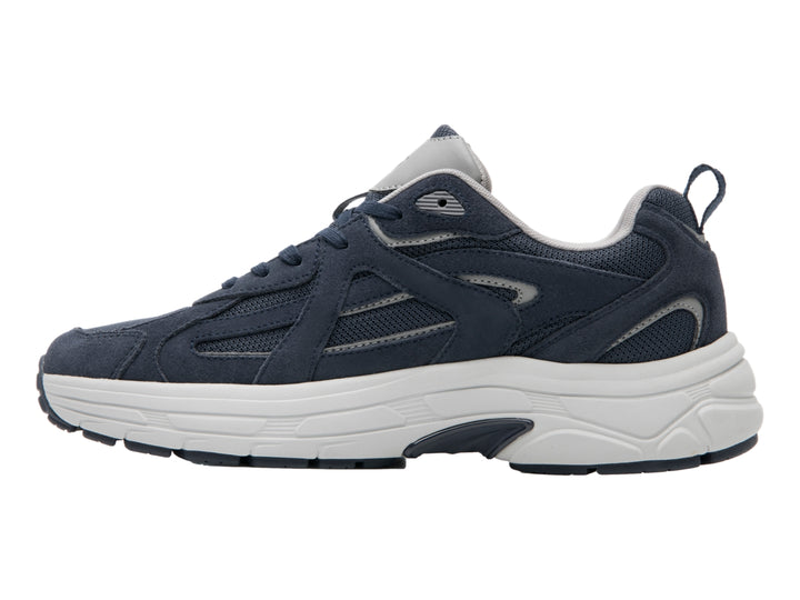 Tenis deportivos Flexi en color azul marino con suela blanca y detalles sintéticos.