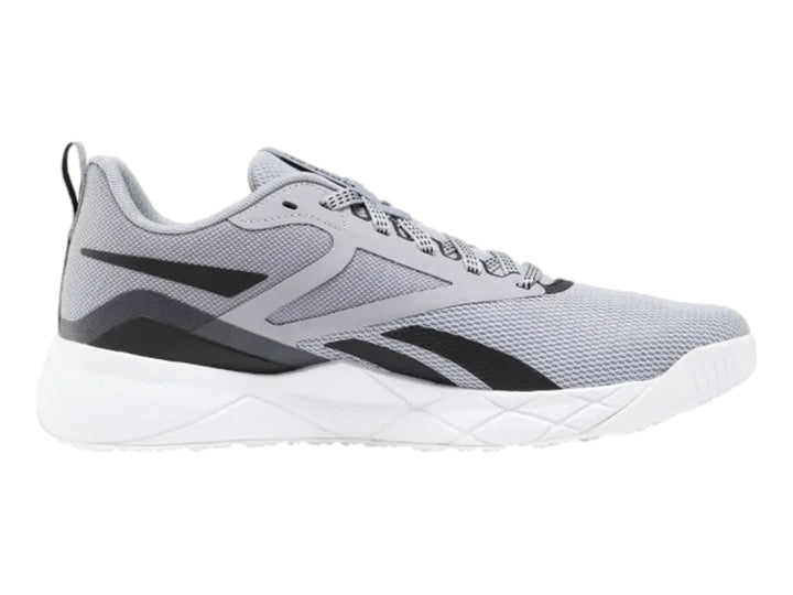 Tenis deportivos Reebok en color gris con detalles negros y suela blanca.