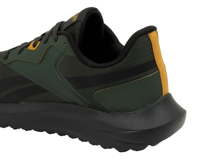 Tenis deportivos Reebok en color verde oscuro y negro con detalles en dorado.