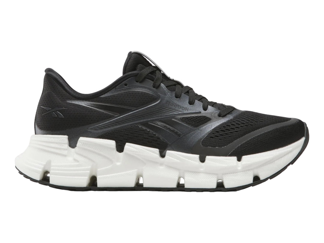 Tenis deportivos Reebok Floatride Energy en color negro con suela blanca robusta.