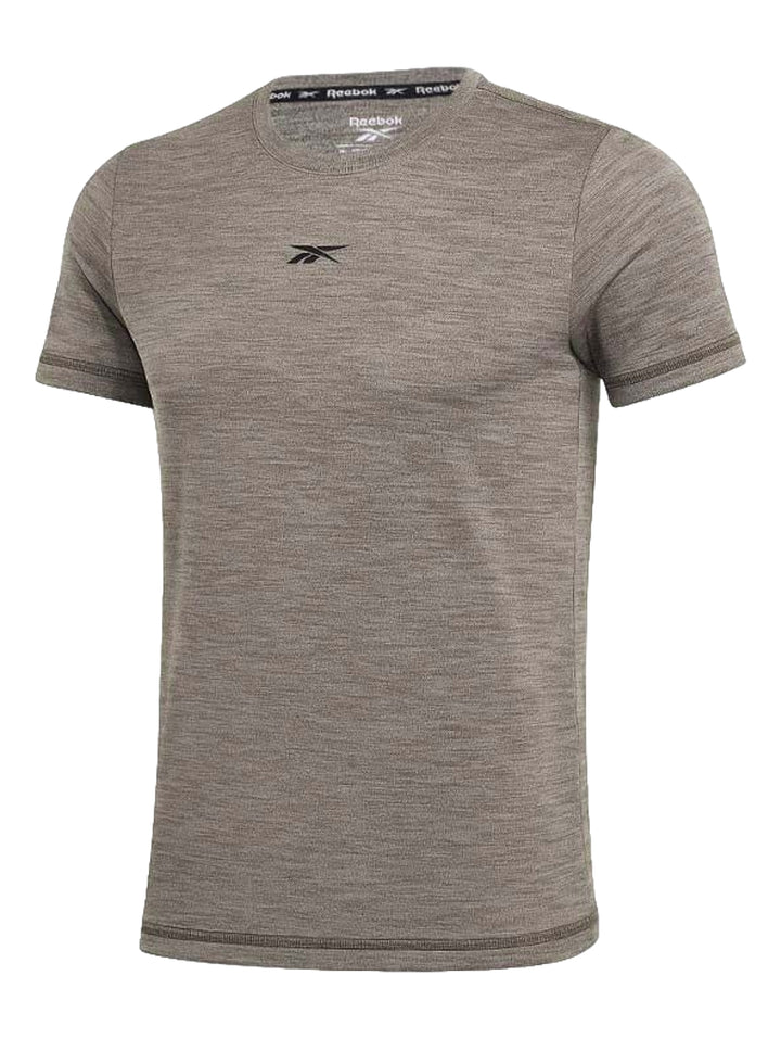 Camiseta deportiva Reebok de manga corta en color verde militar jaspeado con logo en el pecho.