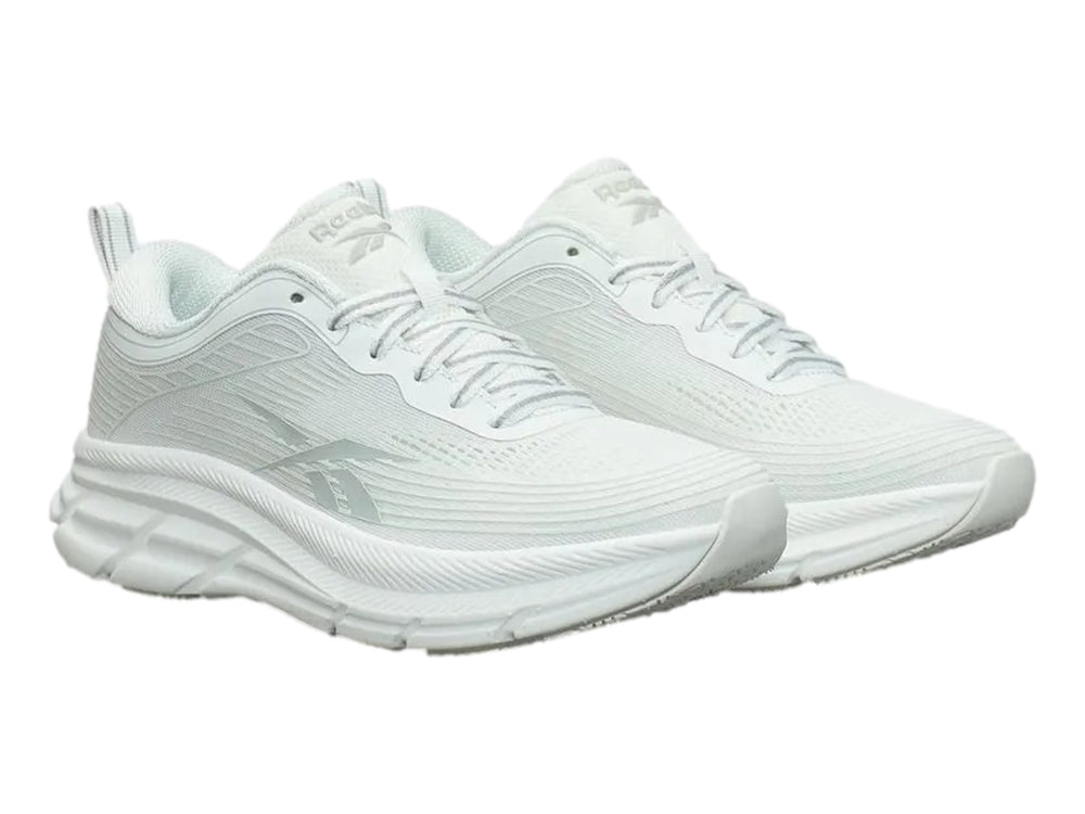 Tenis deportivos Reebok Road Strider color blanco con detalles en gris y suela blanca.
