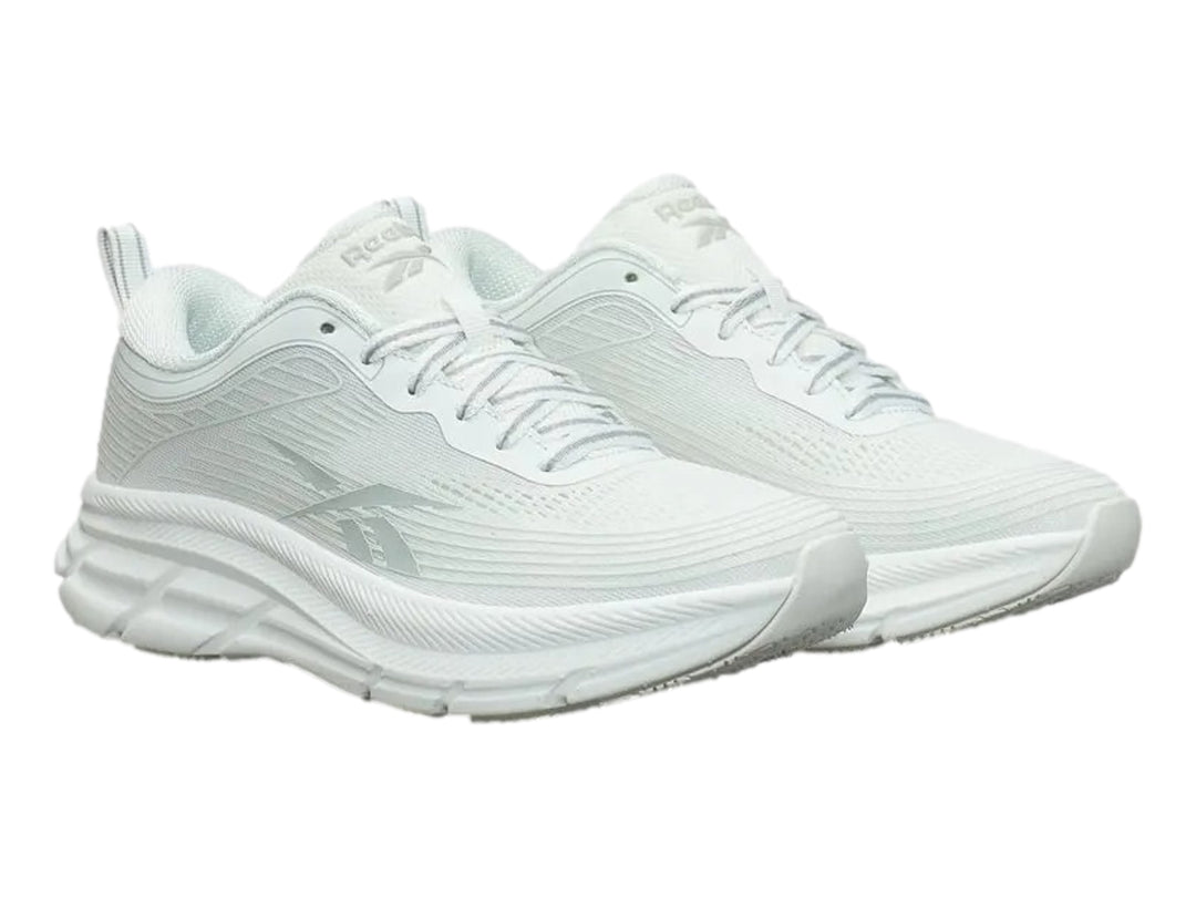 Tenis deportivos Reebok Road Strider color blanco con detalles en gris y suela blanca.