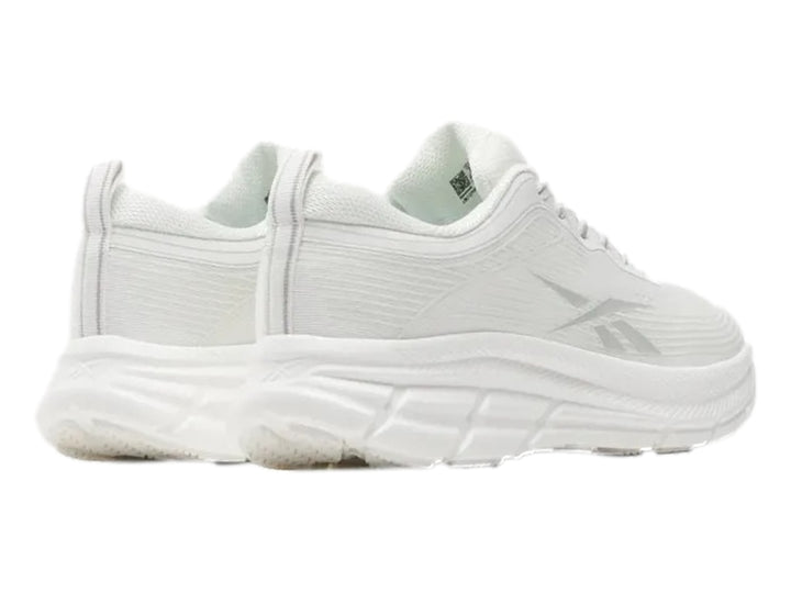 Tenis deportivos Reebok Road Strider color blanco con detalles en gris y suela blanca.
