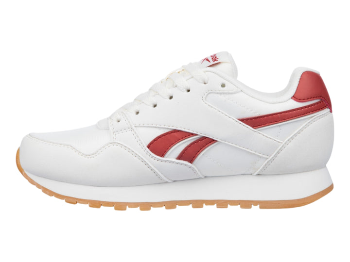 Tenis Reebok color blanco con detalles en rojo y suela de goma color café.