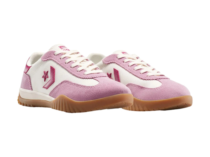 Tenis Converse Run Star Trainer en colores rosa y blanco con suela color café.