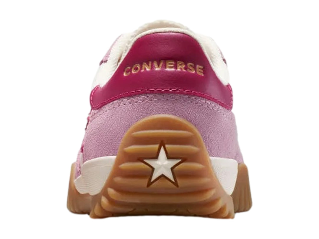 Tenis Converse Run Star Trainer en colores rosa y blanco con suela color café.