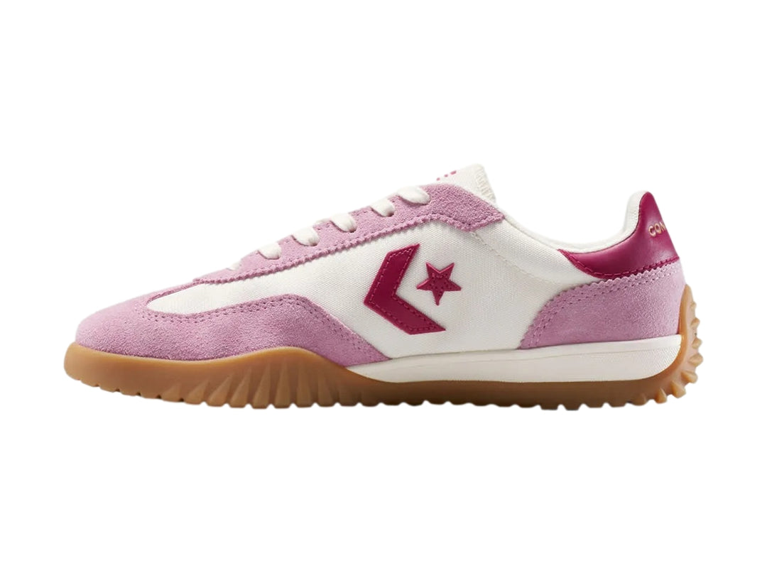 Tenis Converse Run Star Trainer en colores rosa y blanco con suela color café.