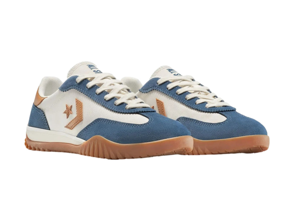 Tenis Converse Run Star Trainer en colores azul, blanco y café con suela de goma marrón.