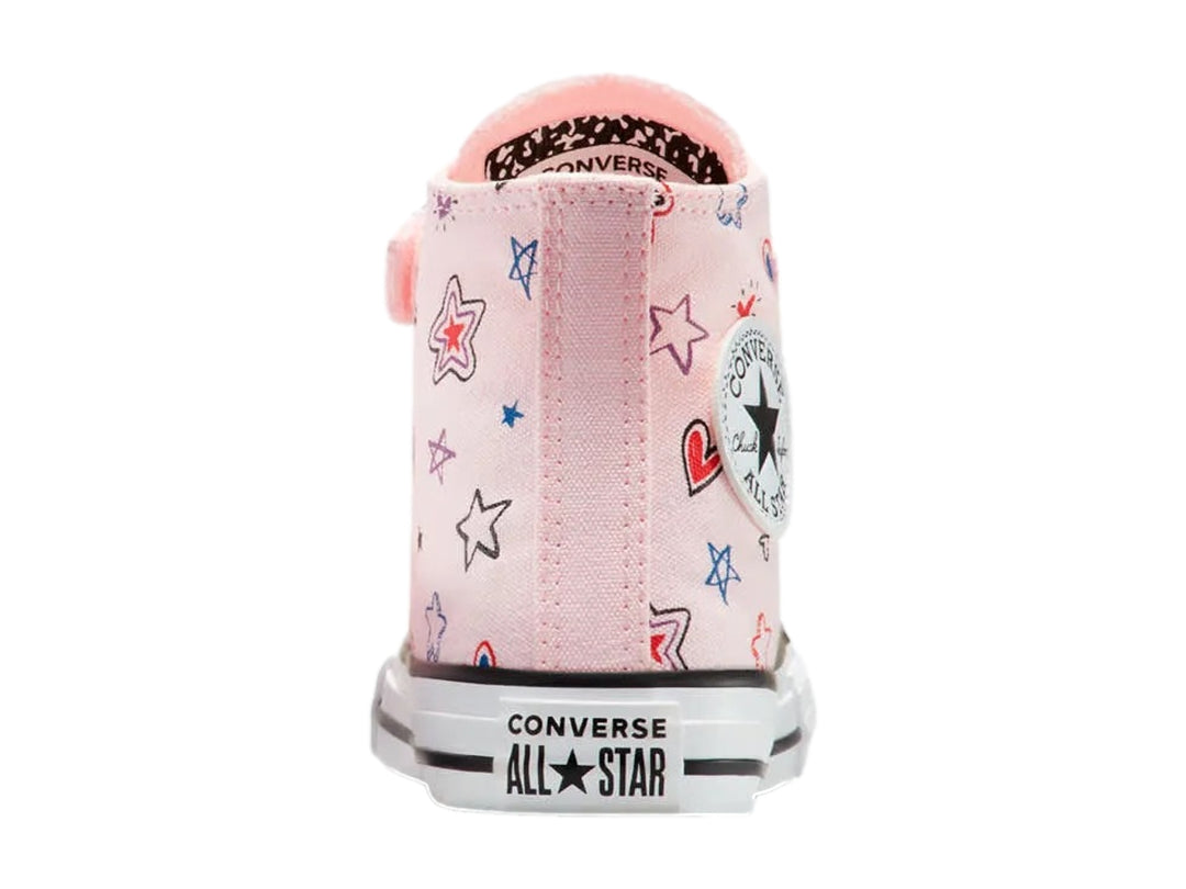 Tenis Converse rosa de bota para Niño o Niña con estampado de estrellas y corazones, suela blanca y correa de velcro.