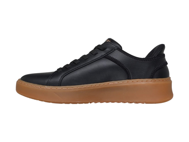Tenis Skechers negros con suela de plataforma color café y agujetas negras.