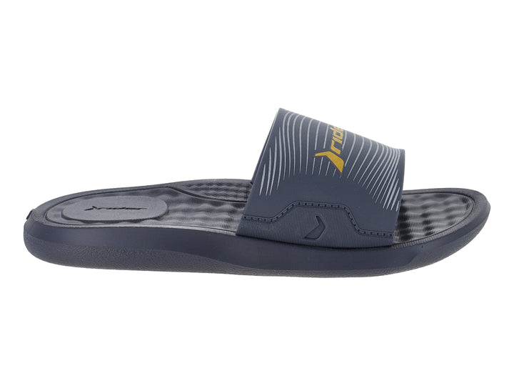 Sandalia slide infantil Rider en color gris oscuro con logo amarillo.