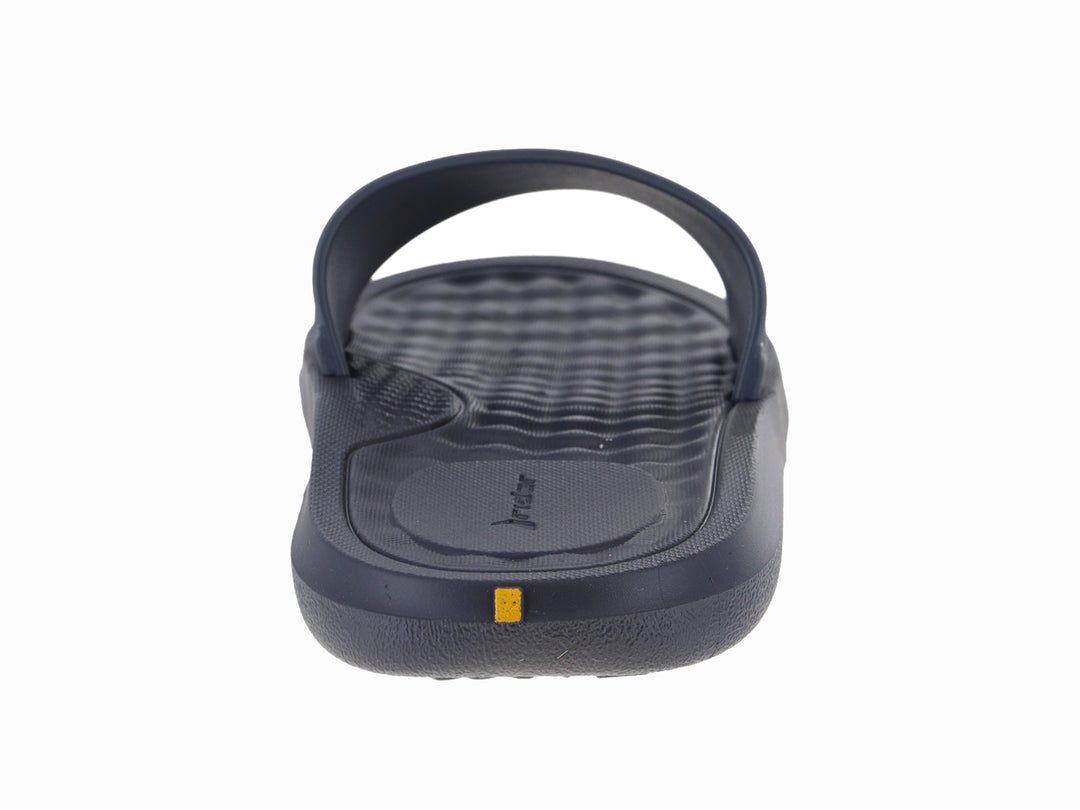 Sandalia slide infantil Rider en color gris oscuro con logo amarillo.