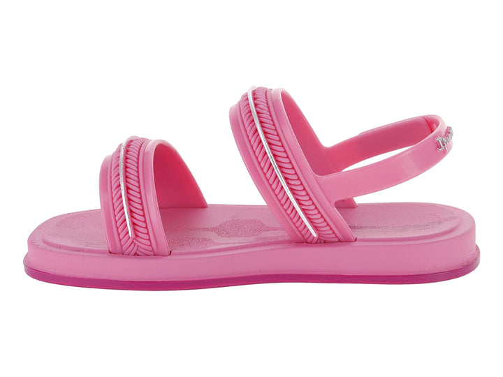 Sandalia infantil color rosa con detalles plateados brillantes y tiras ajustables.