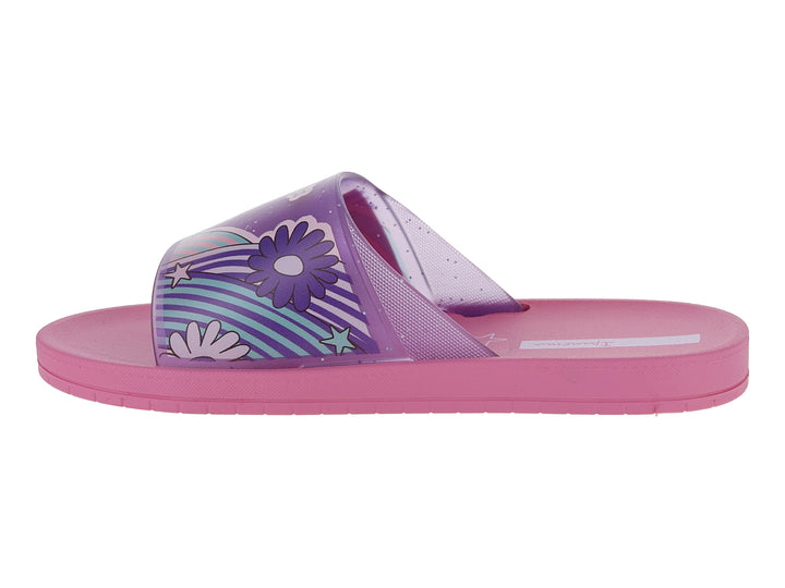 Sandalias slide Ipanema en color rosa y morado con diseño de estrellas y rayas coloridas en la banda.