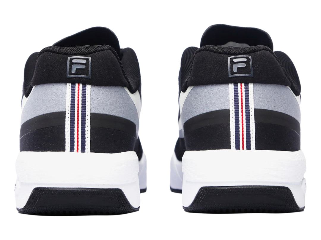 Tenis deportivos FILA FX-25 en color negro con detalles en gris y suela blanca, vista lateral.