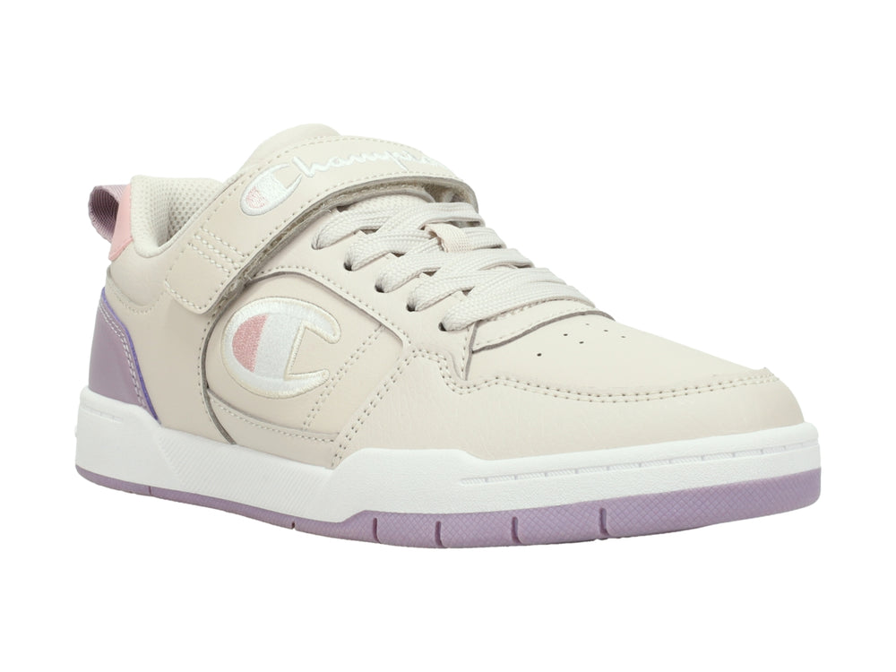 Tenis Champion color beige y morado con correa ajustable y suela blanca.