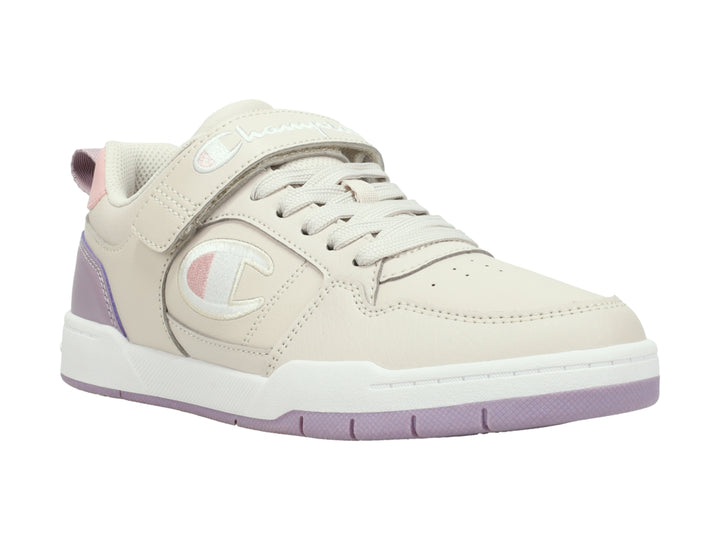 Tenis Champion color beige y morado con correa ajustable y suela blanca.