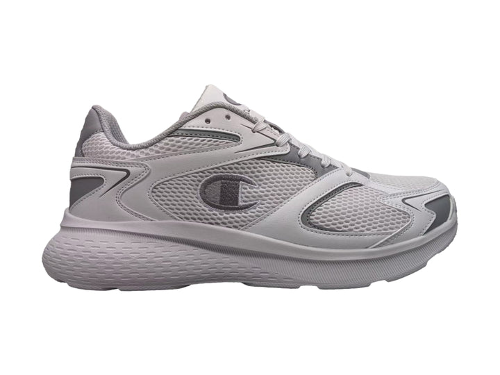 Tenis deportivos Champion color gris con tejido de malla y suela robusta.