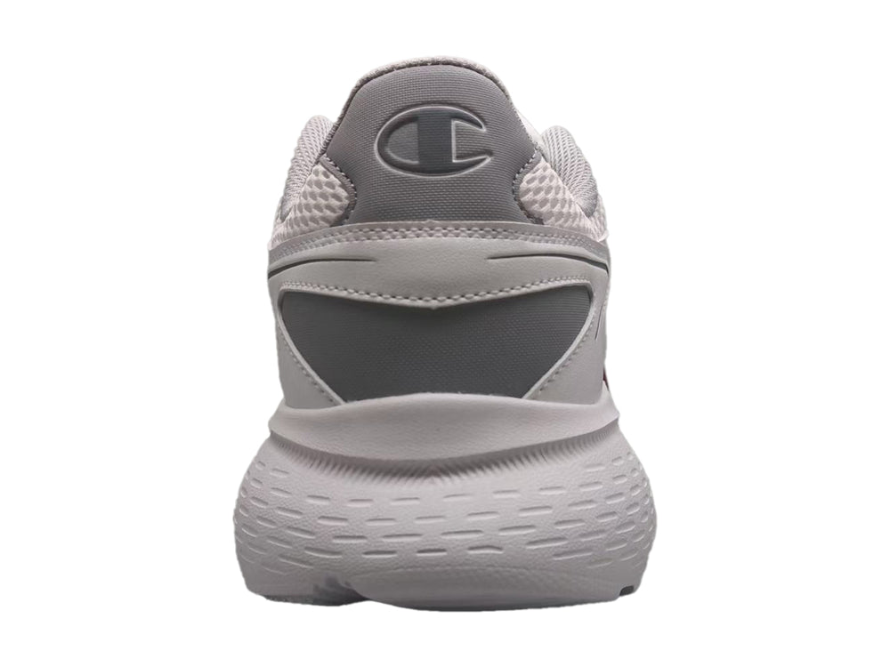 Tenis deportivos Champion color gris con tejido de malla y suela robusta.