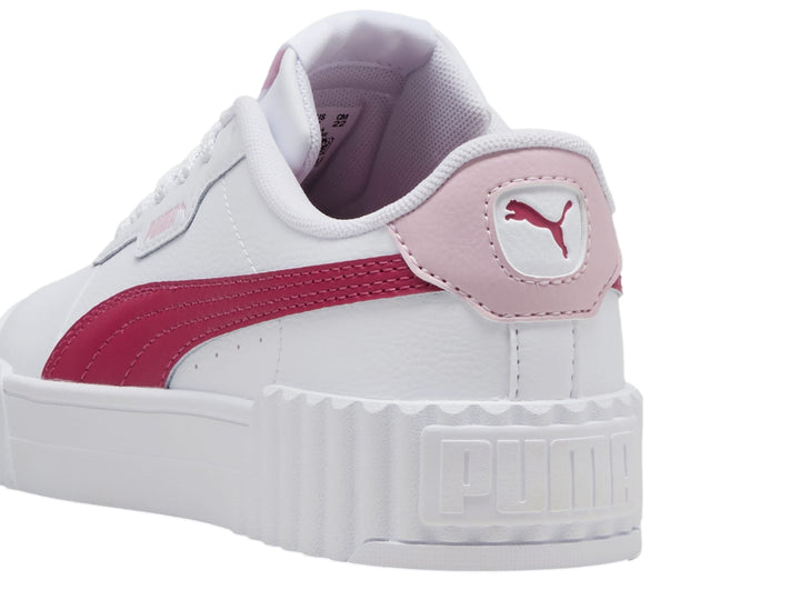 Tenis PUMA Carina 3.0 JR en color blanco con franja y talón en tono rosa y suela de plataforma blanca.