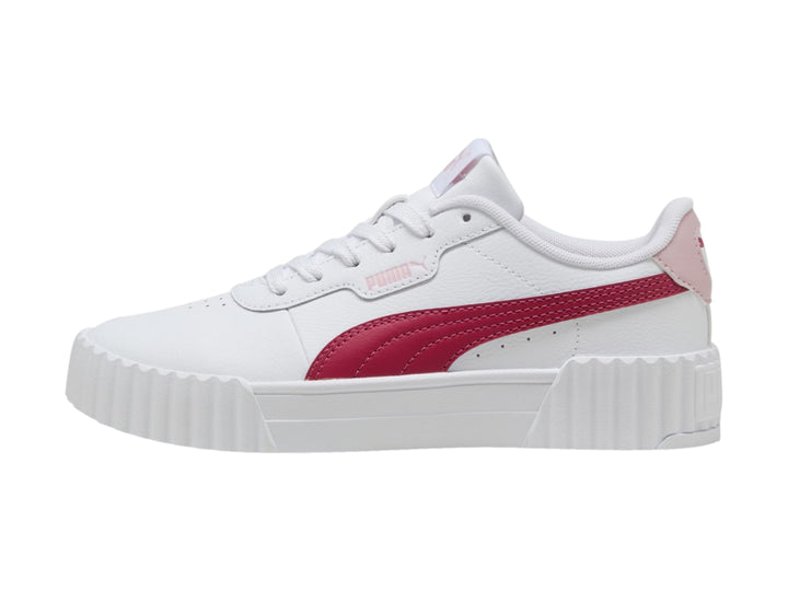 Tenis PUMA Carina 3.0 JR en color blanco con franja y talón en tono rosa y suela de plataforma blanca.