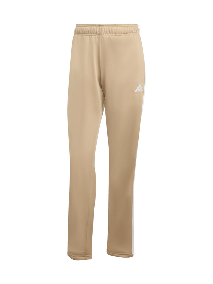 Conjunto deportivo Adidas Essentials color Warm Sandstone compuesto por chaqueta y pantalón con las tres franjas blancas.
