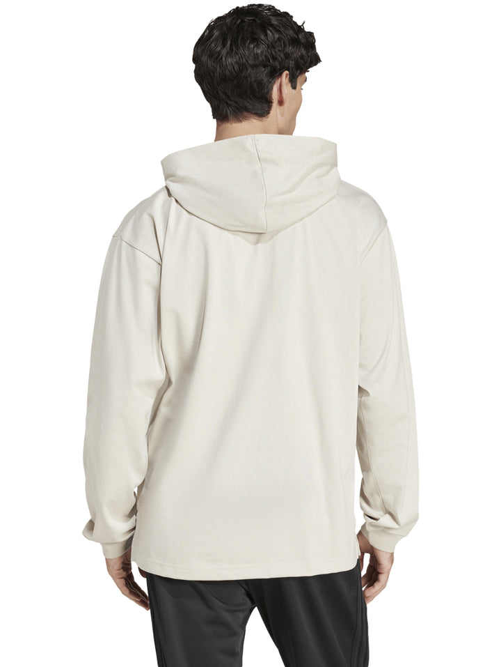 Sudadera Adidas color beige con capucha y detalle gráfico blanco en el pecho.
