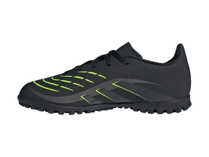 Zapato de fútbol Adidas Predator color negro con detalles en verde lima y suela para césped sintético.