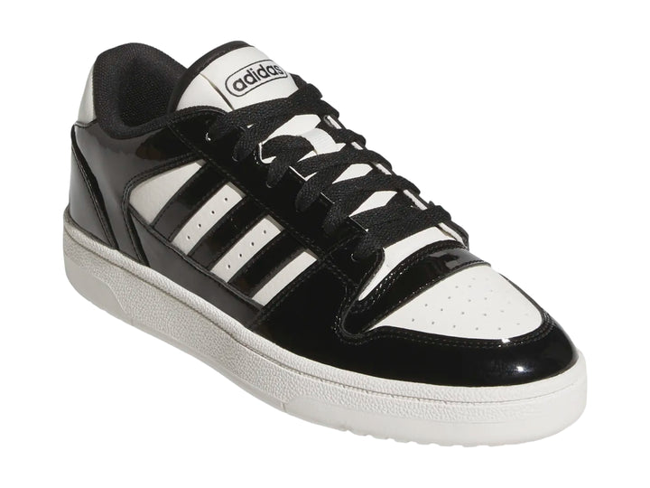 Tenis Adidas Break Start Low color negro brillante con franjas y suela blanca.