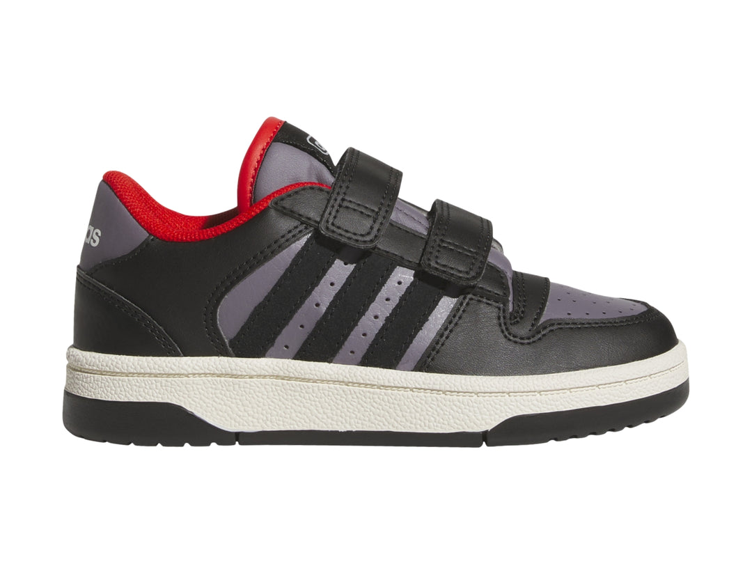 Tenis Adidas infantiles color negro y gris con cierres de velcro y suela blanca.