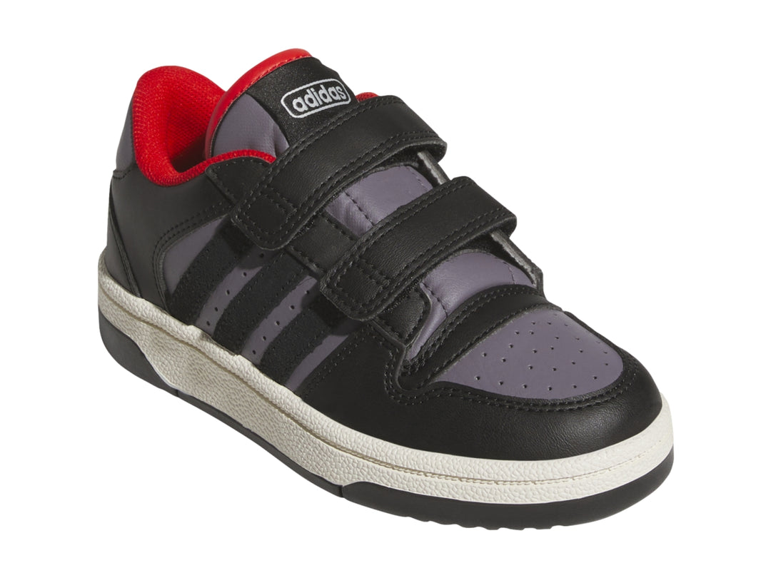 Tenis Adidas infantiles color negro y gris con cierres de velcro y suela blanca.