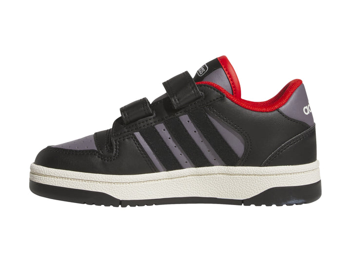 Tenis Adidas infantiles color negro y gris con cierres de velcro y suela blanca.