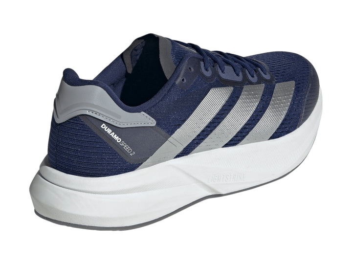 Tenis deportivos Adidas Duramo Speed 2 color azul oscuro con franjas plateadas y suela blanca.