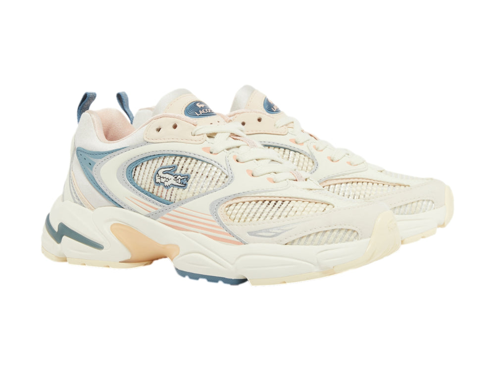 Tenis Lacoste estilo chunky en color blanco roto con detalles en azul y rosa pálido.