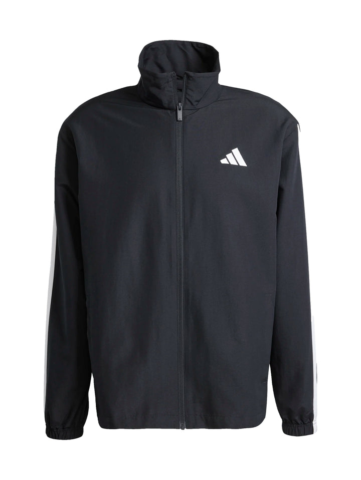 Conjunto deportivo Adidas negro con rayas blancas laterales, compuesto por chamarra y pantalón.