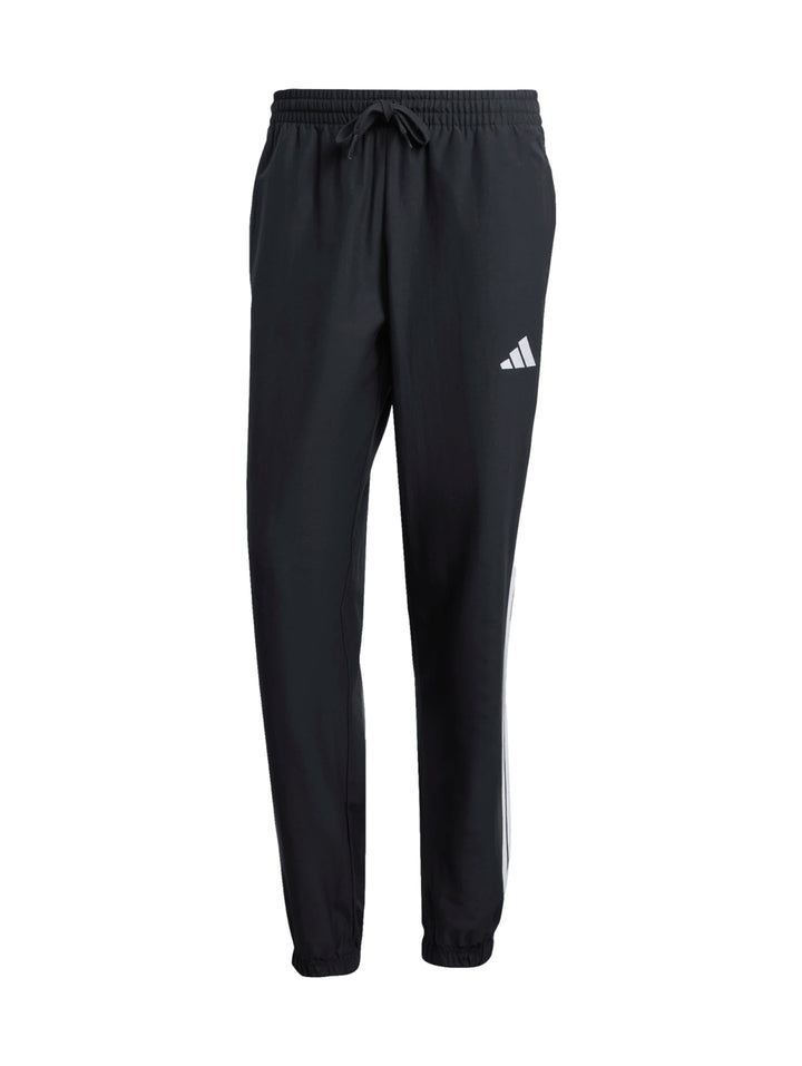 Conjunto deportivo Adidas negro con rayas blancas laterales, compuesto por chamarra y pantalón.