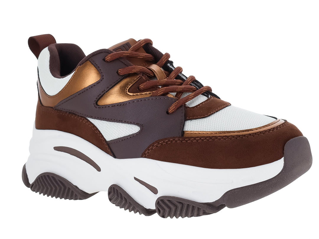Tenis deportivos Steve Madden para niños en colores bronce, marrón y blanco con suela chunky.